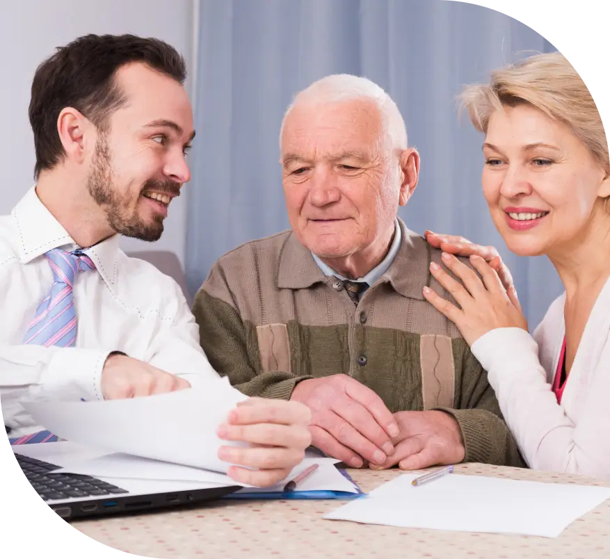 Man helping elderly couple with documents.